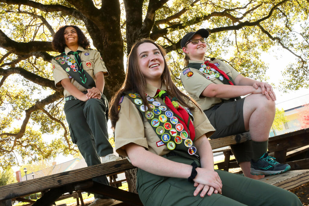 Sierra Robertson, left, 18, of Boy Scout Troop 848 in Petaluma, Ella Jacobs, 15, and Caterina Sharp, 19, both of Boy Scout Troop 55 in Santa Rosa, achieved the rank of Eagle Scout. Megan Fike, another pioneering Eagle Scout from Troop 55, is not pictured.  (Christopher Chung/ The Press Democrat)