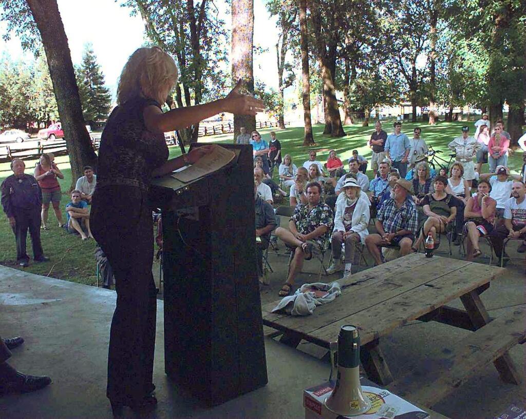 FILE photo, 2000 – Erin Brockovich gestures to the audience at Recreation Grove in Willits during her talk about pollution and health.
