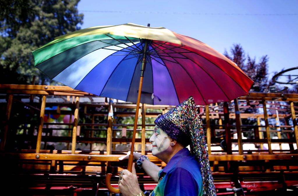 Jim Nichols dressed as Sister Beatrix Uppersleeve of the Russian River Sisters of Perpetual Indulgence prepares to take part in the Sonoma County Pride Parade in Guerneville, Sunday, June 7, 2015. (Beth Schlanker / The Press Democrat file)