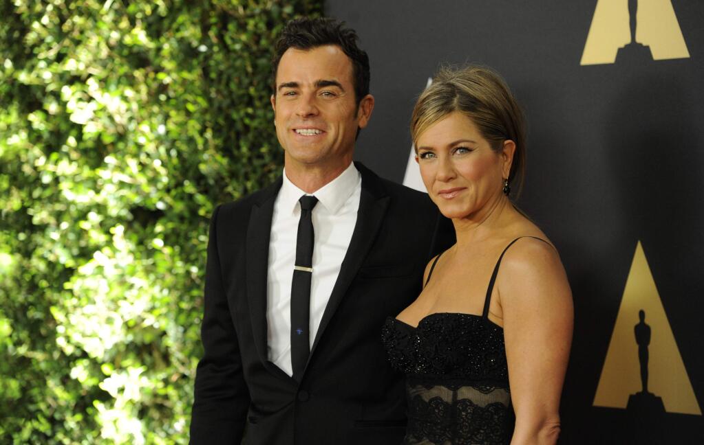 Justin Theroux, left, and Jennifer Aniston arrive at the 6th annual Governors Awards at the Hollywood and Highland Center on Saturday, Nov. 8, 2014 in Los Angeles. (Photo by Chris Pizzello/Invision/AP)