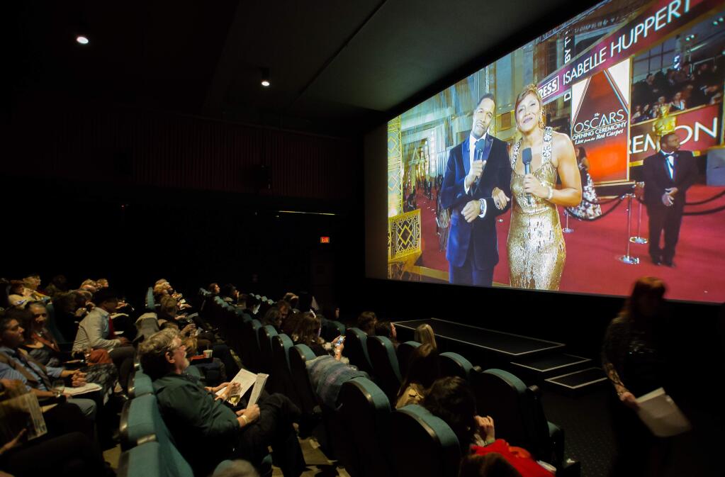 Guests watch a live-stream of the Academy Awards during an Oscar party at Rialto Cinemas in Sebastopol, Calif., Sunday Feb. 26, 2018. The fundraiser for Food for Thought featured movie trivia contests, raffle prizes and the Academy Awards live on the big screen. This year's Oscars viewing at Rialto Cinemas will be on Feb. 24. (Jeremy Portje / For The Press Democrat)