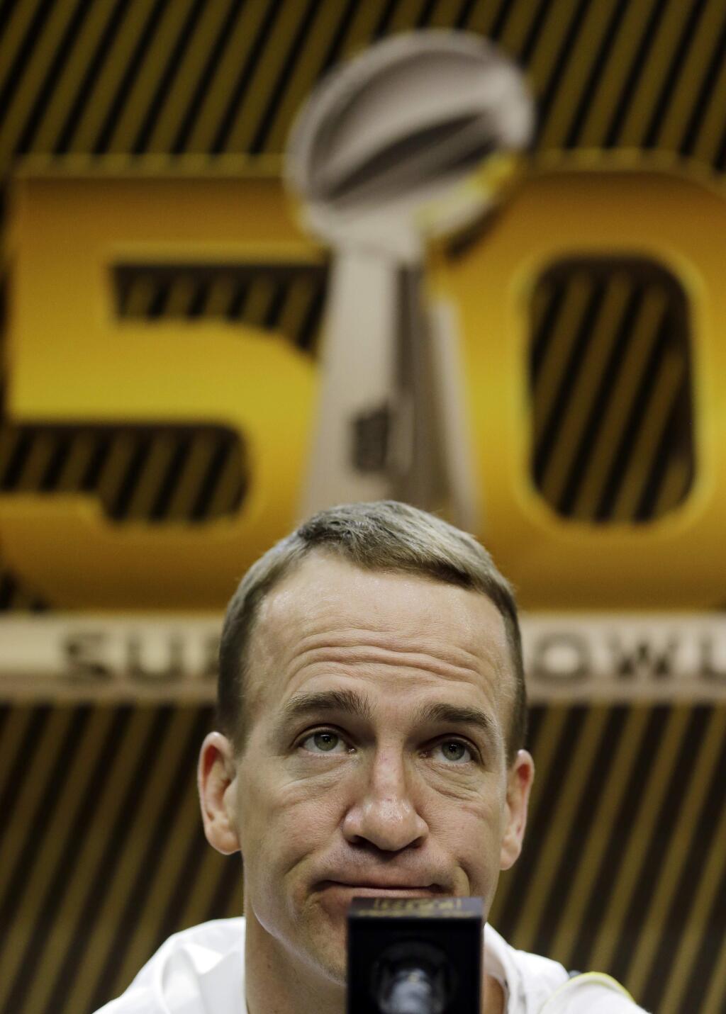 Denver Broncos' Peyton Manning answers a question during Opening Night for the NFL Super Bowl 50 football game Monday, Feb. 1, 2016, in San Jose, Calif. (AP Photo/David J. Phillip)