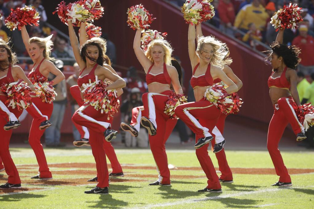 Cheerleaders perform in the first half of an NFL football game between the Kansas City Chiefs and the New York Jets in Kansas City, Mo., Sunday, Nov. 2, 2014. (AP Photo/Charlie Riedel)