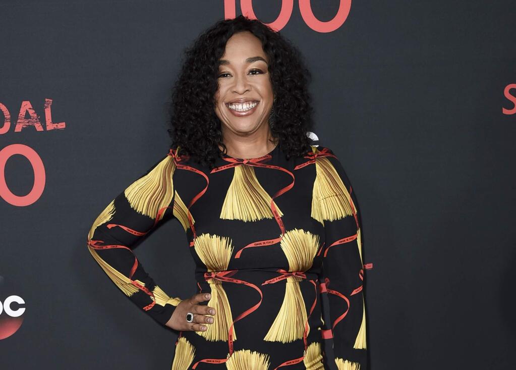 FILE - In this April 8, 2017, file photo, Shonda Rhimes attends the 'Scandal' 100th Episode Celebration at Fig & Olive in West Hollywood, Calif. Netflix announced late Sunday, Aug. 13, that Rhimes and her company Shondaland had agreed to produce new series and context for the streaming service. Rhimes‚Äô current hit shows, ‚ÄúGrey‚Äôs Anatomy,‚Äù ‚ÄúScandal‚Äù and ‚ÄúHow to Get Away With Murder,‚Äù will continue to air on ABC. (Photo by Richard Shotwell/Invision/AP, File)