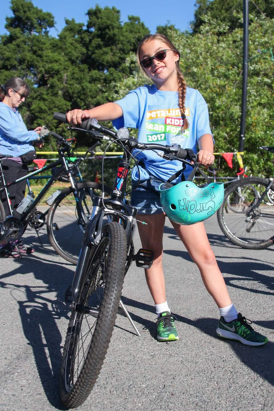 Olivia Chase, age 10, who has raised the most money for Petaluma Kids Gran Fondo for the last three years, waits for the race to begin at Lucchesi Park on Sunday, May 21, 2017. (ASHLEY COLLINGWOOD/FOR THE ARGUS-COURIER)