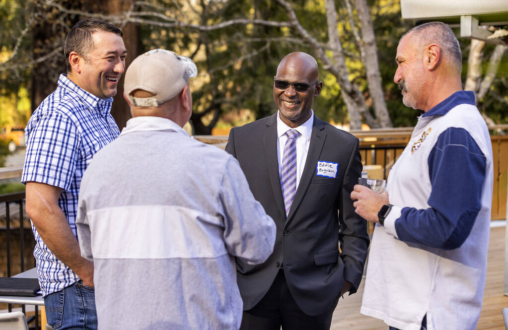 Sonoma County Sheriff Candidate Eddie Engram, center, talks with Brandon Jones, left, Chuck Limbert and John Stephens at a meet-and-greet at the Dawn Ranch in Guerneville on Thursday, March 24 2022. (John Burgess/The Press Democrat)