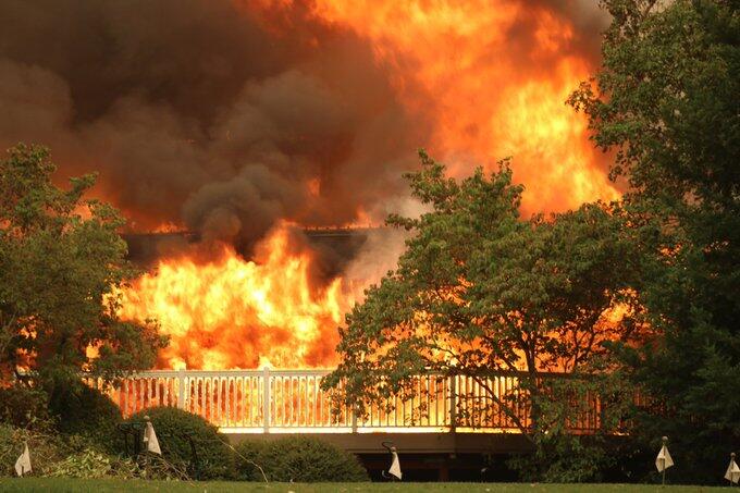 The Glass fire burns Meadowood Resort on Monday, Sept. 28, 2020. (Derek Moore/For The Press Democrat)