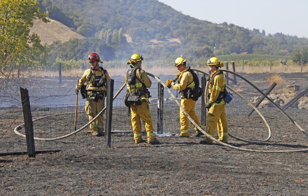 Firefighters from Cal Fire and Sonoma Valley Fire and Rescue battled a field fire on Grove Street in 2019. Grove Street neighbors have already formed their own Fire Safe Council. Photos by Bill Hoban/Index-Tribune