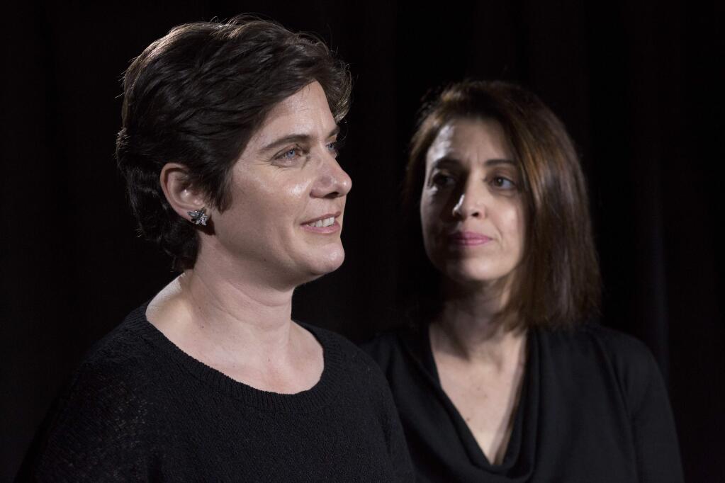 Filmmakers Moira Demos, left, and Laura Ricciardi talk during an interview, Friday, Oct. 19, 2018, in New York. (AP Photo/Mark Lennihan)