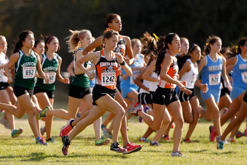 Santa Rosa's Delaney White, center front, Kirsten Carter, and Aimee Holland compete in the Division I girls race during the NCS Cross Country Championship in Hayward on Nov. 21, 2015. (Alvin Jornada / The Press Democrat)