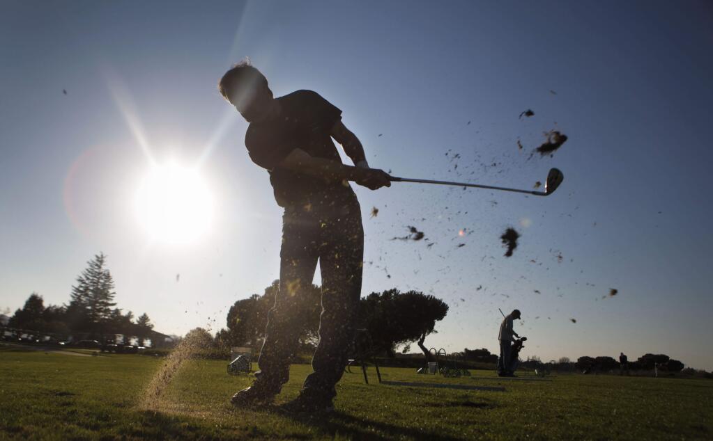 Petaluma, CA, USA. Monday, November 14, 2016._ Paul Ghiringhelli practices on the driving range at the Adobe Creek Golf Course which will be closing in January.(CRISSY PASCUAL/ARGUS-COURIER STAFF)