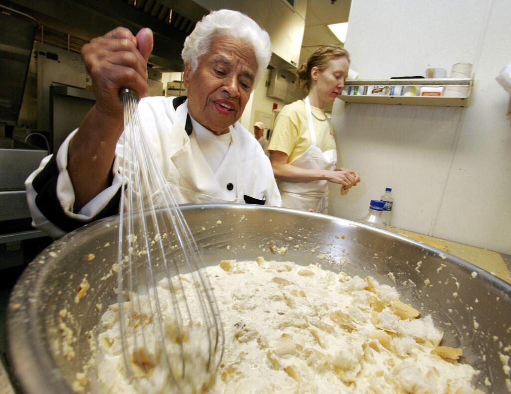 FILE - In this April 12, 2006, file photo, Leah Chase mixes her bread pudding at Muriel's restaurant in New Orleans. The legendary New Orleans chef and civil rights icon Leah Chase has died at 96, according to a statement her family released to news outlets. (AP Photo/Alex Brandon, File)