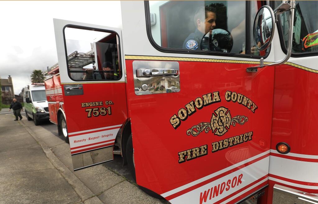 Sonoma County Fire District captain Keith Muelheim of Windsor's station one, prepares to leave the scene of an under control medical aid with his crew, Wednesday, April 3, 2019 in Windsor. Several departments, including Mountain, Windsor, Bennett Valley and Rincon Valley are operating under the Sonoma County Fire District umbrella now. (Kent Porter / The Press Democrat) 2019