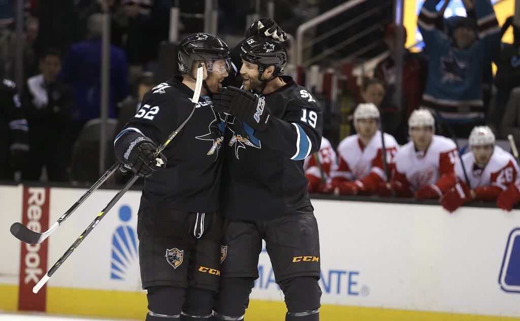 San Jose Sharks' Matt Irwin, left, is congratulated by Joe Thornton (19) after Irwin scored against the Detroit Red Wings during the first period Thursday, Feb. 26, 2015, in San Jose. (AP Photo/Ben Margot)
