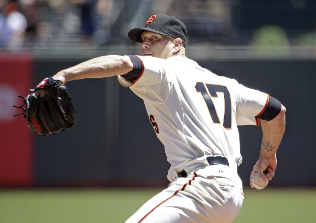 San Francisco Giants starting pitcher Tim Hudson throws against the Oakland Athletics in the first inning of their interleague baseball game Thursday, July 10, 2014, in San Francisco. (AP Photo/Eric Risberg)