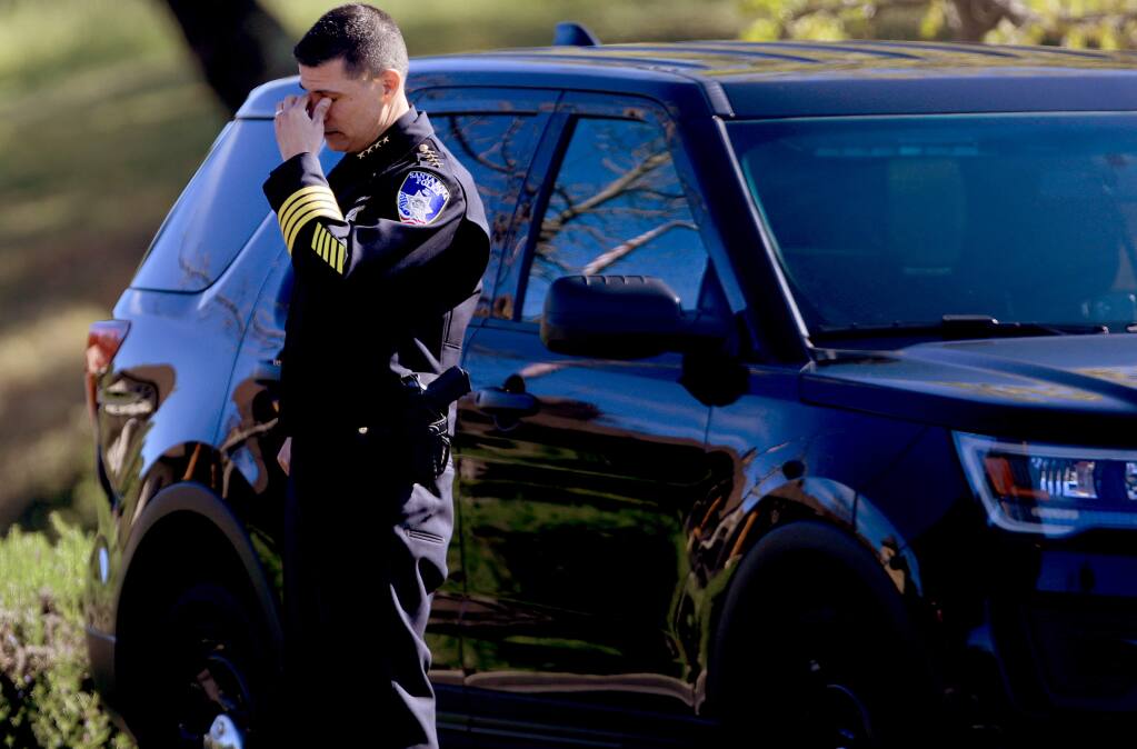 Santa Rosa Police Chief Rainer Navarro wipes away tears after a law enforcement procession to Tulocay Cemetery and Funeral Home, Friday, April 3, 2020, honoring SRPD Detective Marylou Armer, who died of complications from the coronavirus. (Kent Porter / The Press Democrat) 2020