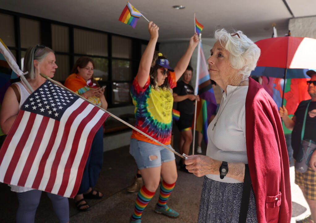 A protester of the drag story hour who declined to identify herself gathers outside the Windsor Regional Library in Windsor, Sunday, June 18, 2023. (Beth Schlanker /The Press Democrat)