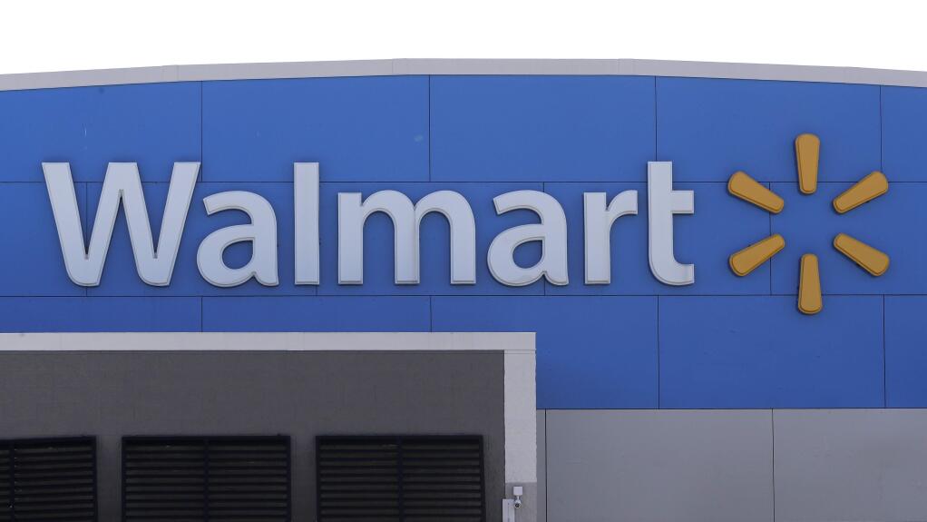 FILE - In this Sept. 3, 2019 file photo, a Walmart logo is displayed outside of a Walmart store, in Walpole, Mass. (AP Photo/Steven Senne, File)