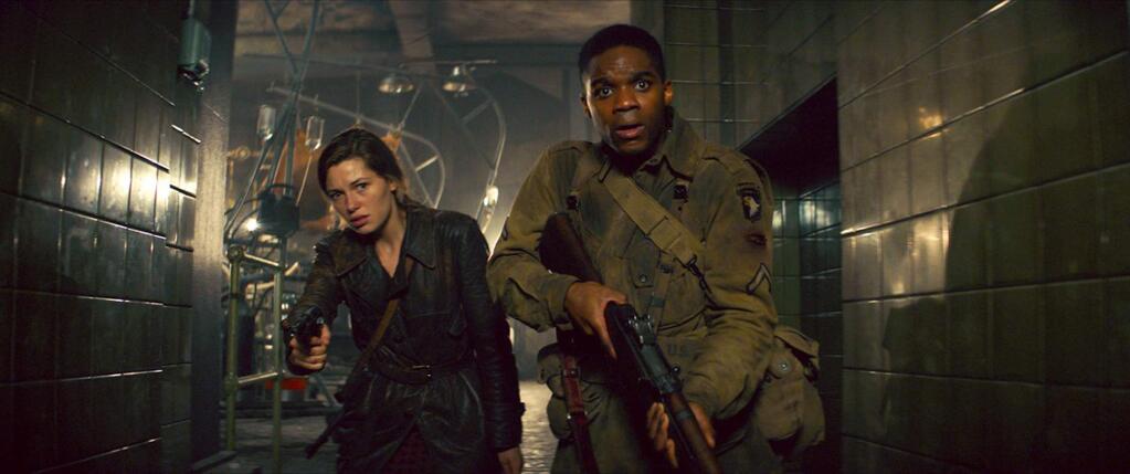 Jovan Adepo and Mathilde Ollivier in a scene from 'Overlord,' about a team of American paratroopers who land into Nazi-occupied France just before D-Day on a secret mission but run into a mysterious Nazi lab and enemies unlike the world has ever seen before. (Paramount Pictures)