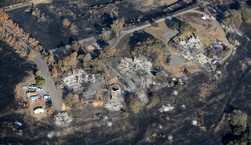 Three homes burned on Susan Road as the Glass fire marched west in the Highway 12 corridor Wednesday, Oct. 7, 2020 in east Santa Rosa. (Kent Porter / The Press Democrat) 2020