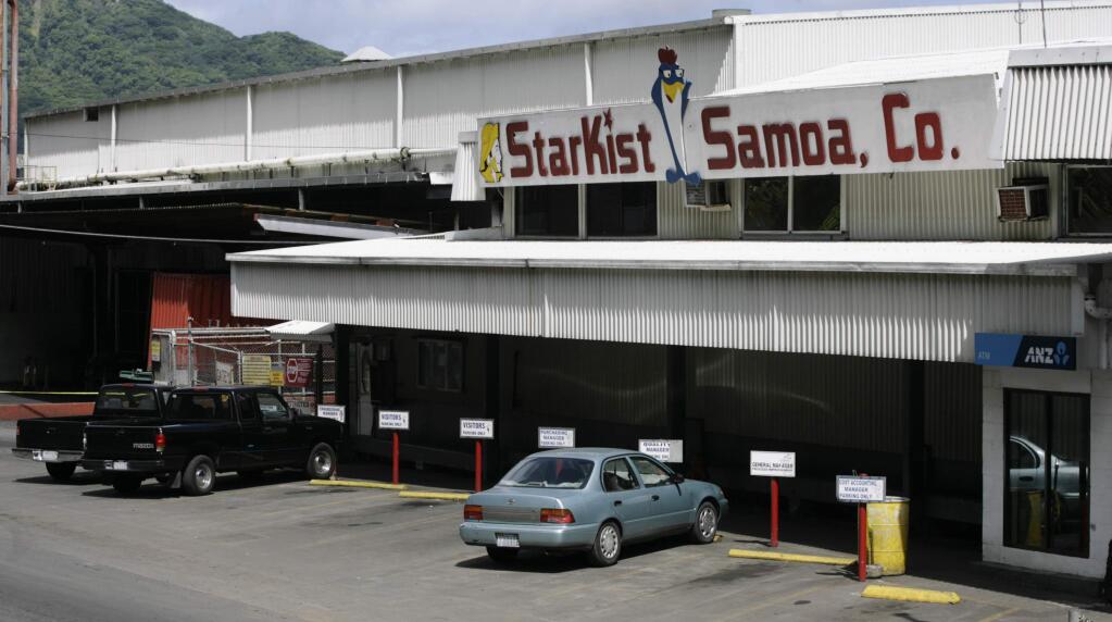 File - This Oct 3, 2009 file photo shows the Starkist Samoa Co. tuna cannery in Pago Pago, American Samoa. Authorities say StarKist has agreed to plead guilty to price fixing as part of a broad collusion investigation of the industry. Federal prosecutors announced the plea agreement Thursday and said the company faces a maximum fine of $100 million. Bumble Bee Foods last year pleaded guilty to the same charge and paid a $25 million fine. (AP Photo/Eugene Tanner, file)