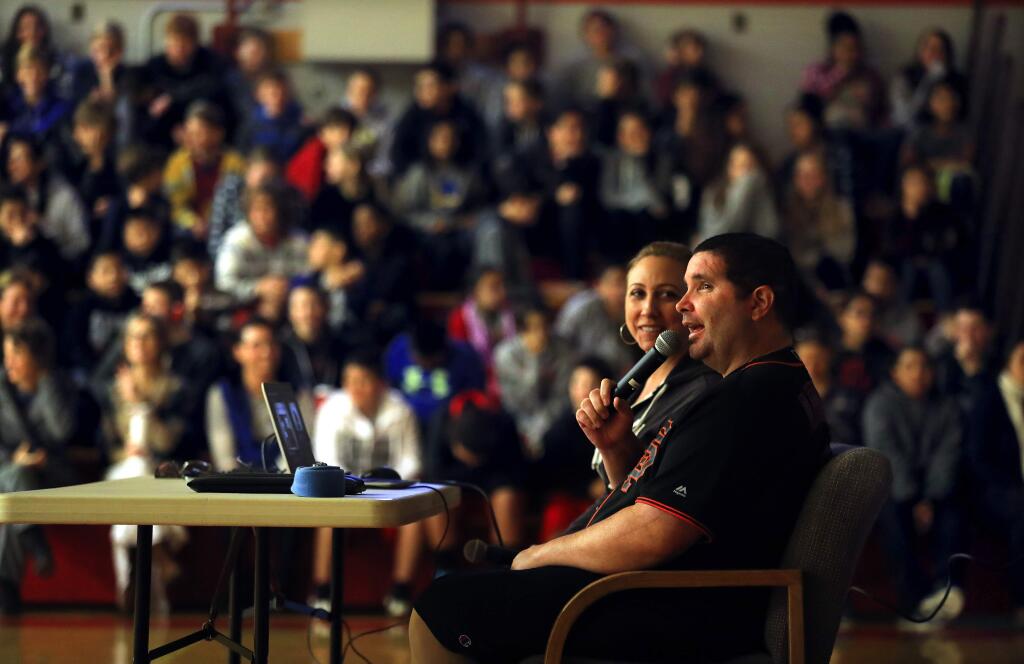 Bryan Stow, the Giants fan who was beaten into a coma outside Dodger Stadium in 2011, with his sister Erin Collins talked to Herbert Slater Middle School students about bullying and his recovery. (John Burgess/The Press Democrat)