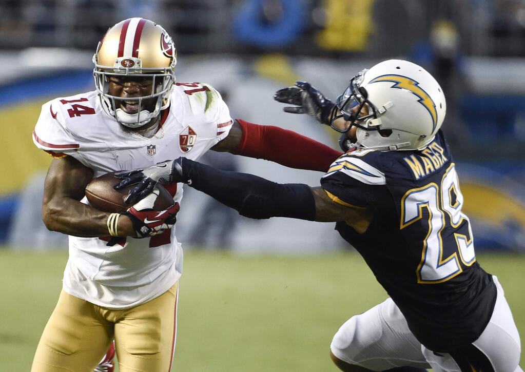 San Francisco 49ers wide receiver Eric Rogers, left, pushes off San Diego Chargers cornerback Craig Mager during the first half of an NFL preseason football game Thursday, Sept. 1, 2016, in San Diego. (AP Photo/Denis Poroy)
