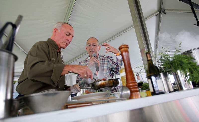 Steve Rose of Vineyards Inn Spanish Bar and Grill, left, participates in the Steel Chef Competition while Clark Wolf describes his dish at the Taste of Sonoma at MacMurray Ranch in Healdsburg, Sept. 1, 2012.