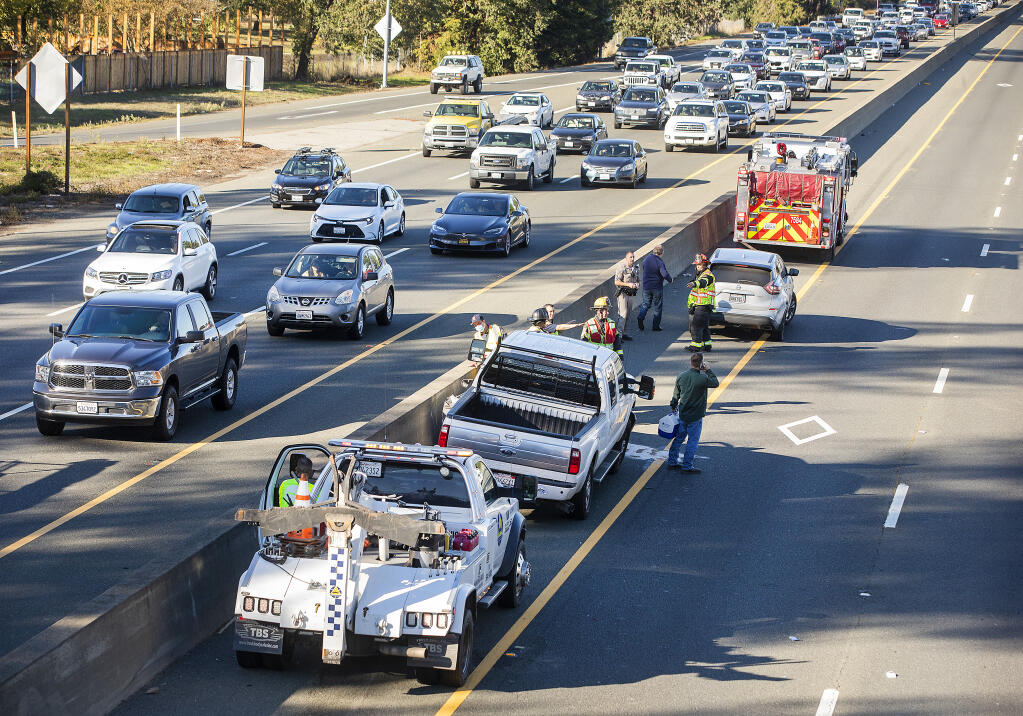 One person suffered minor injuries Thursday afternoon following a crash in the northbound lanes of Highway 101 near the Todd Road off-ramp on Thursday, Oct. 28, 2021. The crash occurred about 3:30 p.m. and blocked two lanes of traffic, causing a major backup.  (John Burgess/The Press Democrat)