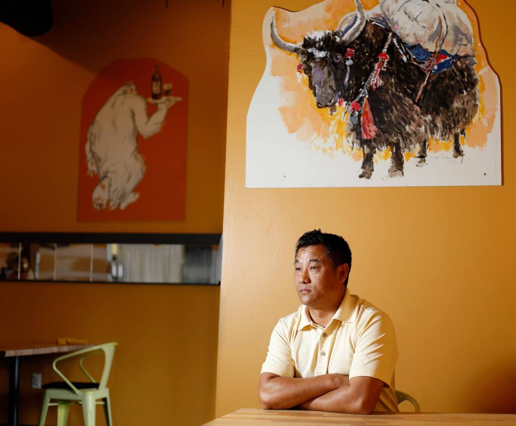 Pemba Sherpa, co-owner of restaurants Yak and Yeti, in Napa, and La Casa, in Sonoma, poses for a portrait at Yak and Yeti restaurant in Napa, California, on Saturday, April 28, 2018. Sherpa is a naturalized U.S. citizen who emigrated from Nepal. (Alvin Jornada / The Press Democrat)