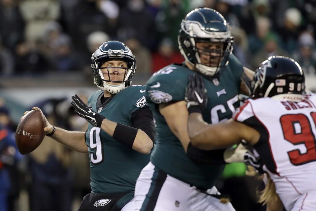 Philadelphia Eagles' Nick Foles in action during the first half of an NFL divisional playoff football game against the Atlanta Falcons, Saturday, Jan. 13, 2018, in Philadelphia. (AP Photo/Matt Rourke)