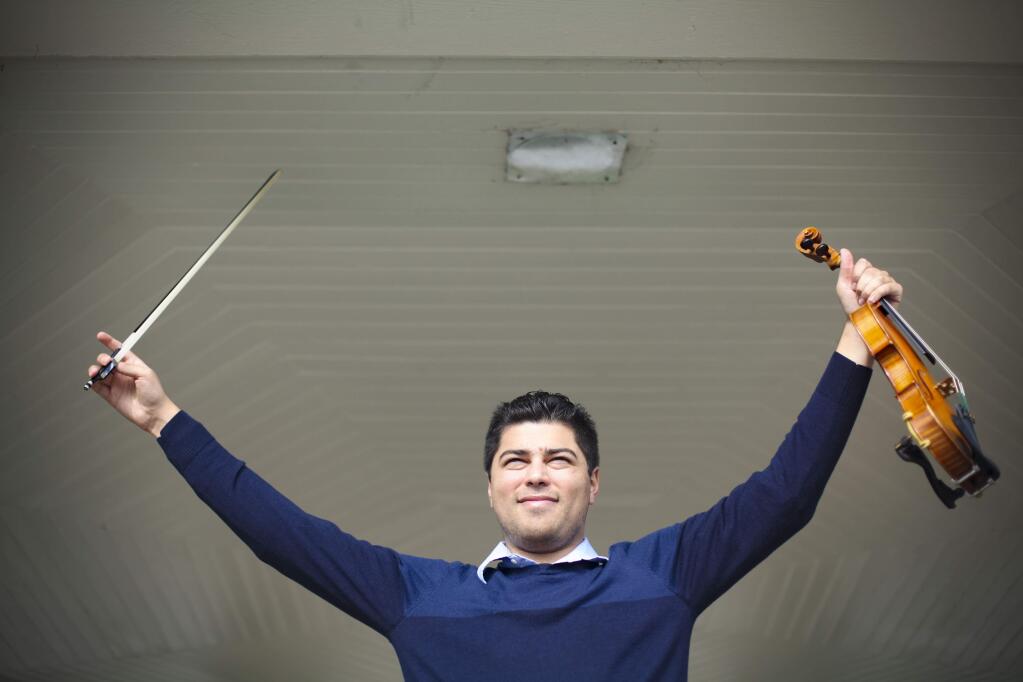 Kyle Craft, a graduate of Petaluma HS has been playing the violin since he was 4. He learned to speak German from his grandmother and specializes in music from 19th century Vienna. (CRISTINA PASCUAL/ARGUS-COURIER STAFF)