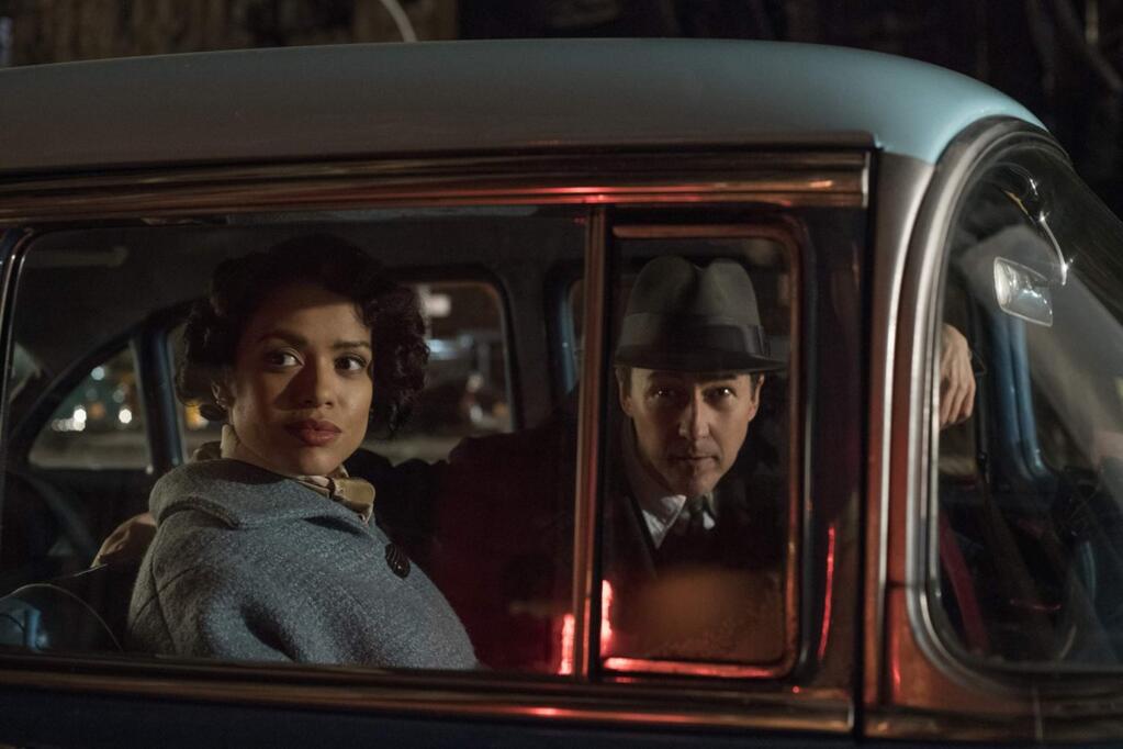 Edward Norton as Lionel Essrog and Gugu Mbatha-Raw as Laura Rose in 'Motherless Brooklyn,' a story set in 1957 New York City, about a private investigator with Tourette's syndrome who must solve the murder of his mentor (Bruce Willis). (Warner Bros. Pictures)