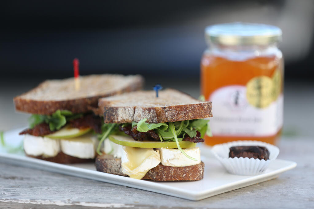 The Porky Peach Sandwich features homemade Peach Habanero jam, bacon, Brie cheese, apples and arugula at Society Bakery and Cafe in Sebastopol. (Beth Schlanker/The Press Democrat)