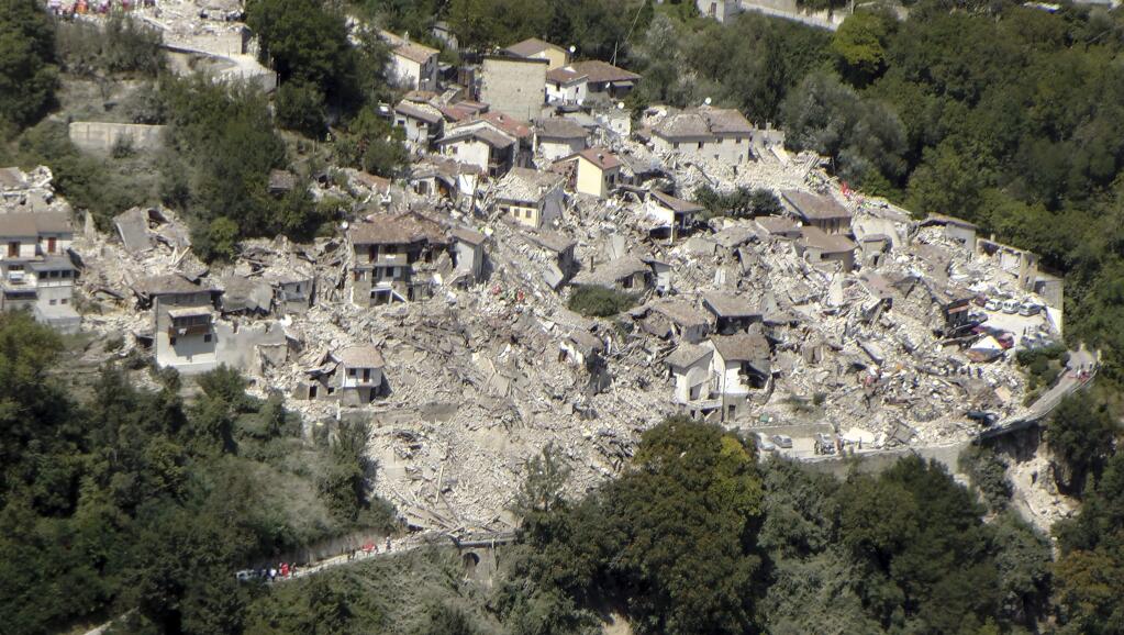 This aerial photo taken Wednesday, Aug. 24, 2016 and made available Thursday, Aug. 25, 2016 shows the damage done after an earthquake in the village of Pescara del Tronto, central Italy. Rescue crews raced against time Thursday looking for survivors from the earthquake that leveled three towns in central Italy, but the death toll rose to 247 and Italy once again anguished over trying to secure its medieval communities built on seismic lands. (Italian Finance Police Guardia di Finanza via AP)