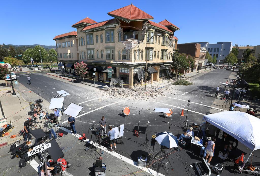KENT PORTER / The Press DemocratOn Brown Street in downtown Napa, tourists and media gather around one of many historic structures that were damaged by the Napa temblor that tipped the scales at 6.0.