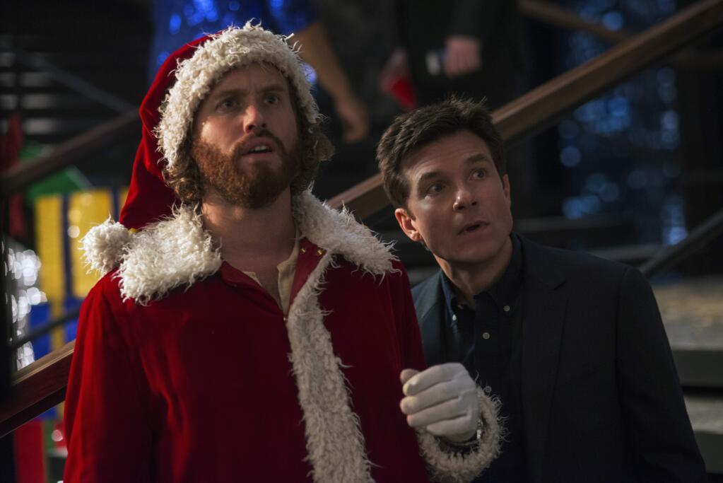 This image released by Paramount Pictures shows T.J. Miller as Clay Vanstone, left, and Jason Bateman as Josh Parker in a scene from 'Office Christmas Party.' (Glen Wilson/Paramount Pictures via AP)