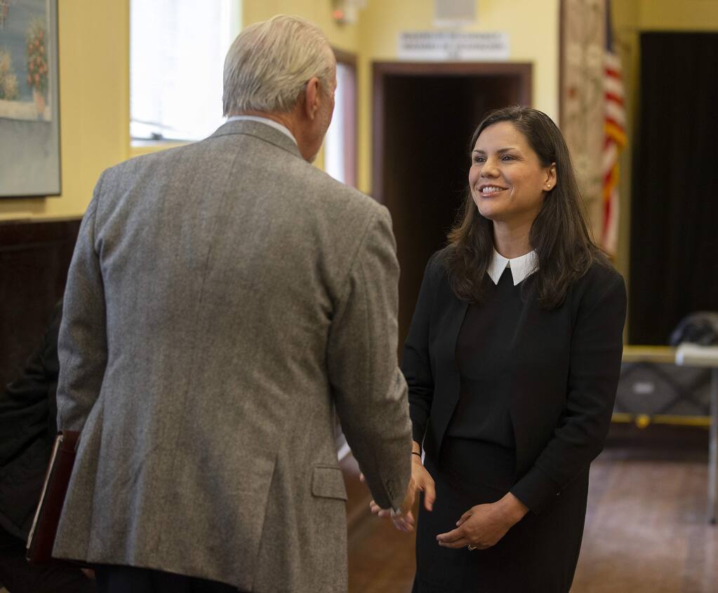 Karlene Navarro, the director of the Sonoma County Independent Office of Law Enforcement Review and Outreach, talks with retired Los Angeles Police Capt. John Mutz before a meeting of the Community Advisory Council in Windsor in 2019. (JOHN BURGESS/ The Press Democrat)