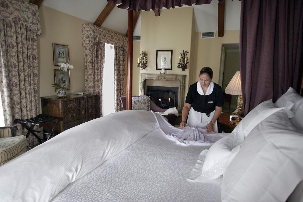 Carmen Barragan sets out a bathrobe at the Les Mars Hotel in downtown Healdsburg in 2010. (PD FILE)