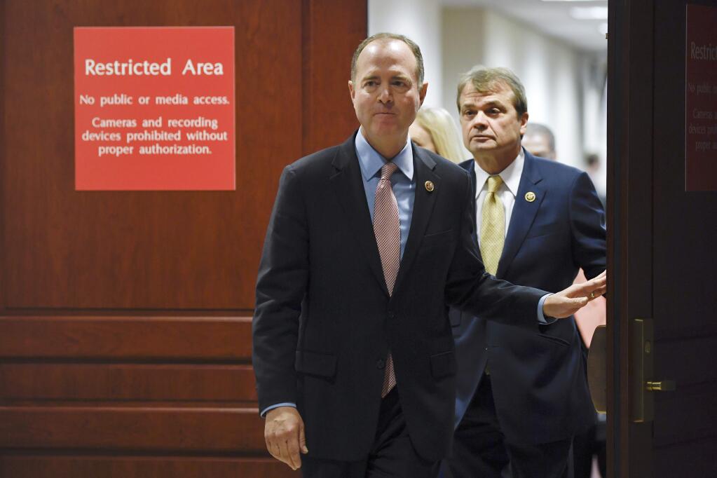 House Intelligence Committee Chairman Adam Schiff, D-Calif., followed by Rep. Mike Quigley, D-Ill., walks out to talk to reporters on Capitol Hill in Washington, Wednesday, Nov. 6, 2019, about the House impeachment inquiry. (AP Photo/Susan Walsh)
