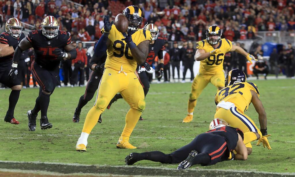 Michael Brockers of the Rams intercepts a pass on the 49ers' two-point conversion attempt off the hands of intended receiver Trent Taylor, Thursday, Sept. 21, 2017 at Levi's Stadium in Santa Clara, keeping the score 41-39 in favor of the Rams. (Kent Porter / The Press Democrat)