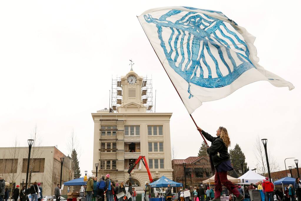 Kym Trippsmith waves her Amazon woman flag at Old Courthouse Square during the third annual Women's March in Santa Rosa on Saturday, Jan. 19, 2019. (Alvin Jornada / The Press Democrat)