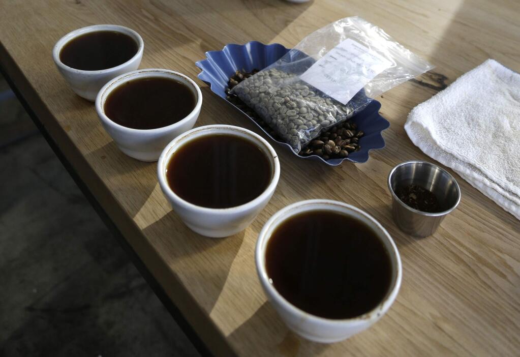 In this Jan. 3, 2013 file photo a row of brewed coffee is seen in Oakland, Calif. (AP Photo/Eric Risberg, File)