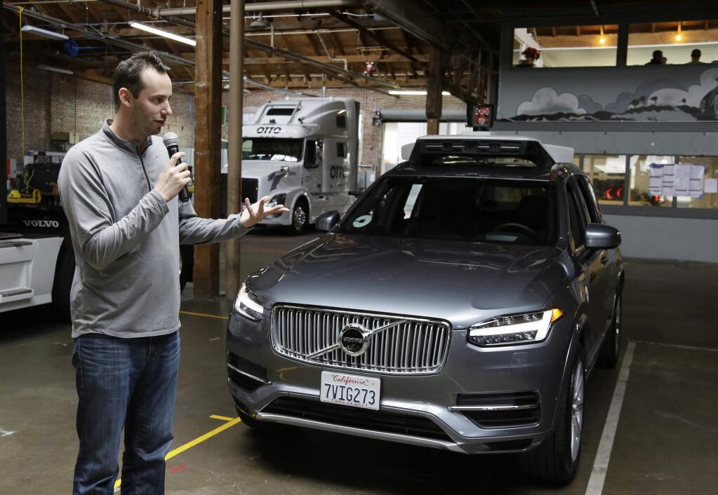 FILE - In this Dec. 13, 2016, file photo, Anthony Levandowski, head of Uber's self-driving program, speaks about their driverless car in San Francisco.(AP Photo/Eric Risberg, File)