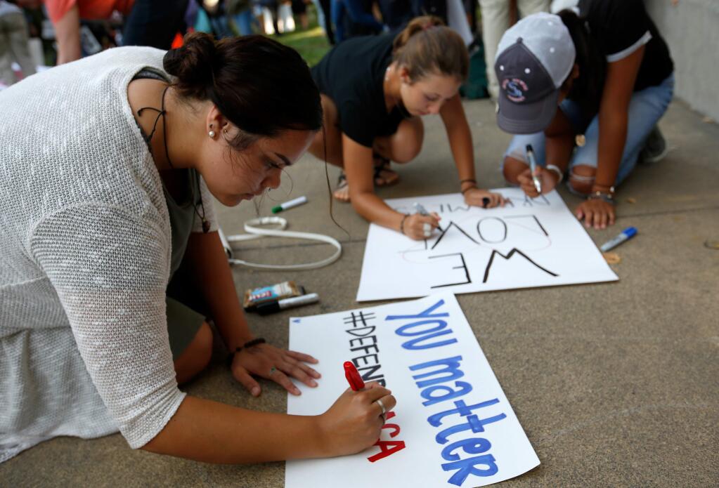 Students and other demonstrators hold a march and rally on the campus of Sonoma State University in protest to the Trump administration rescinding the Delayed Action for Childhood Arrivals (DACA) program, in Rohnert Park, California on Tuesday, September 5, 2017. Montes (Alvin Jornada / The Press Democrat)