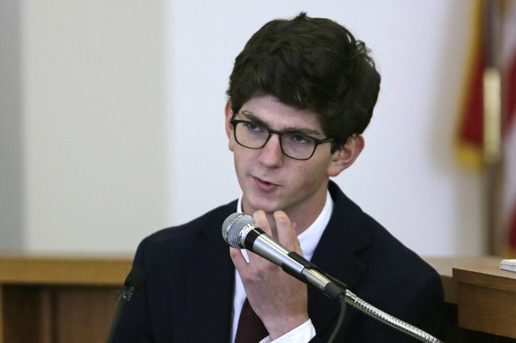 Former St. Paul's School student Owen Labrie scratches his chin while he testifies during his trial at Merrimack Superior Court in Concord, N.H., Wednesday, Aug. 26, 2015. Labrie is charged with raping a 15-year-old freshman as part of Senior Salute, in which seniors try to romance and have intercourse with underclassmen before leaving the prestigious St. Paul's School in Concord. The defense contends the two had consensual sexual contact but not intercourse. (AP Photo/Charles Krupa, Pool)