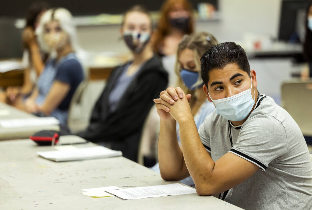Kelvin Castillo, right, wears a mask along with other students in the Introduction to Art and Design class on the first day of on-campus classes at Santa Rosa Junior College on Monday, August 16, 2021.  (John Burgess/The Press Democrat)