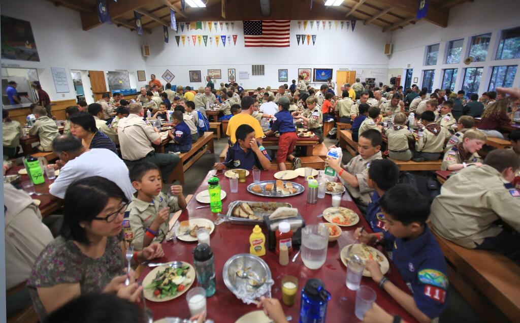 At Camp Royaneh in Cazadero, Monday July 28, 2015, Scouts eat their dinner with den leaders, Scoutmasters and chaperones. (Kent Porter / Press Democrat)