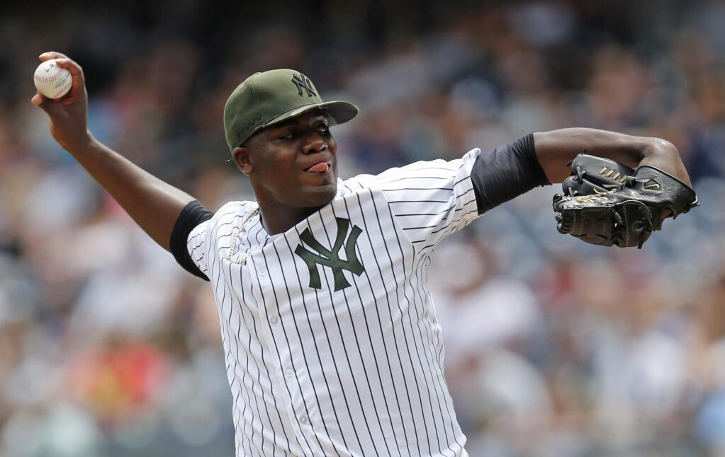 New York Yankees starting pitcher Michael Pineda winds up during the first inning of a baseball game against the Oakland Athletics in New York, Sunday, May 28, 2017. (AP Photo/Kathy Willens)