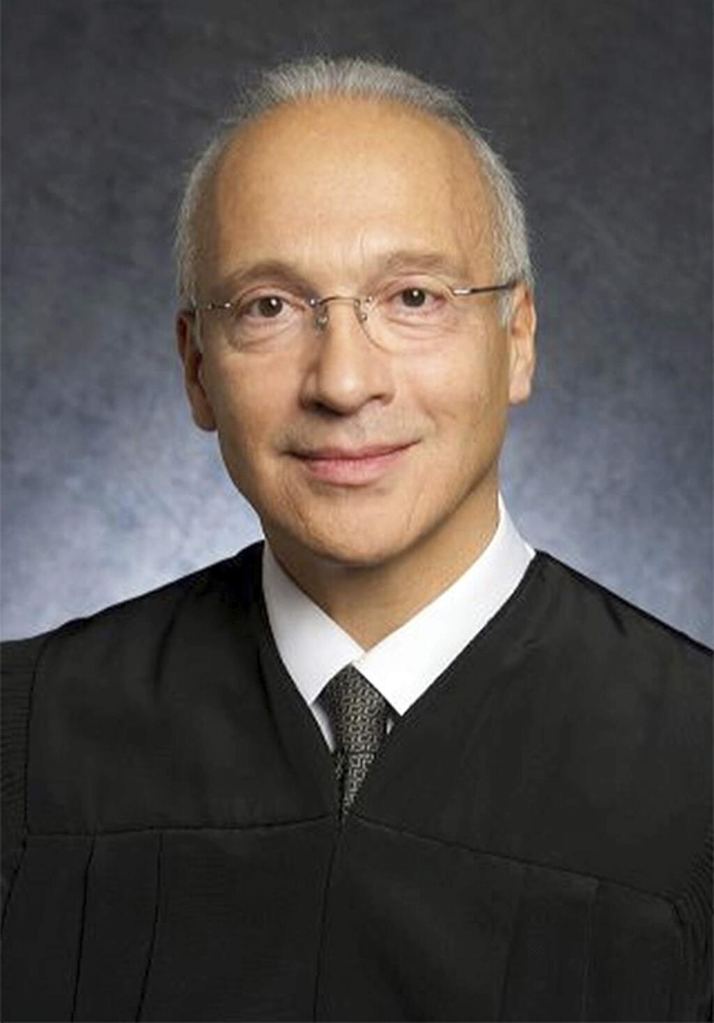 FILE - This undated file photo provided by the U.S. District Court shows Judge Gonzalo Curiel. Lawyers for a Mexican man who was shielded from being deported will try to persuade Curiel, who has been a target of President Donald Trump's scorn, that the administration wrongly expelled their client from the United States. Juan Manuel Montes, 23, is the first known recipient of the five-year-old Deferred Action for Childhood Arrivals program to be deported under Trump. Curiel will hear arguments Tuesday, Aug. 22, 2017. (U.S. District Court via AP, File)